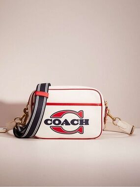 COACH FLIGHT BAG (COACH C4673)
BRASS/CHALK ELECTRIC RED EUC